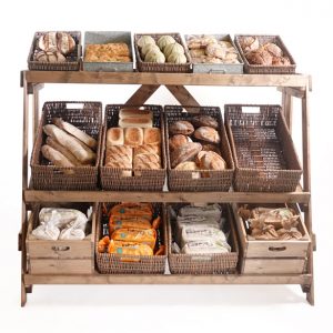 wooden bakery stand with wicker baskets, mult-tier rustic display, large convenience store bread unit,