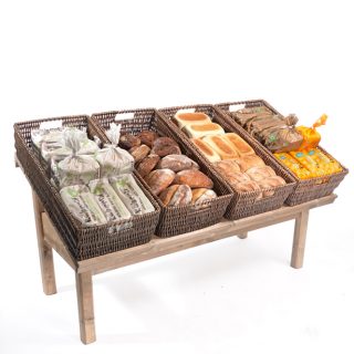 Sloping-Table-with-large-wicker-baskets-bakery-display
